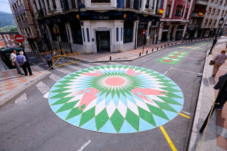 PRAVIA, SPAIN - JUNE 4: Carpets of flowers for the celebration of Corpus Christi  in June 4, 2015 in Pravia, Spain. During the past two months, fifty housewives have been working with flowers, wood chips and tinted salts.のeditorial素材
