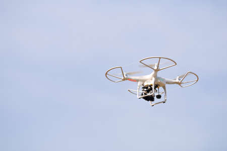 Flying drone in the sky. Flying with an drone for video and photo productions.の写真素材