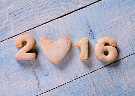 2016 homemade cookies on wooden table in the kitchen