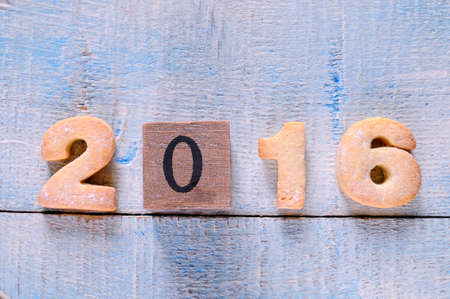2016 homemade cookies on wooden table in the kitchen