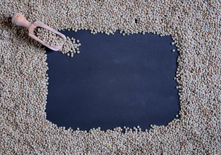 Lentils on a blackboard with space for writingの写真素材