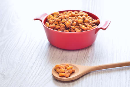 Roasted corn on the wooden table in the kitchen.の写真素材