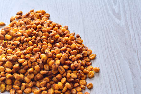 Toasted corn on the wooden table in the kitchen.の写真素材