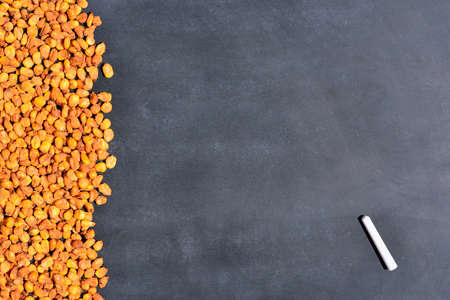 Toasted corn on the blackboard in the kitchen.の写真素材