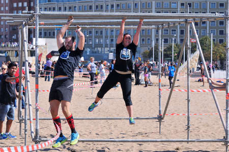 GIJON, SPAIN - SEPTEMBER 19: Storm Race, an extreme obstacle course in September 19, 2015 in Gijon,...