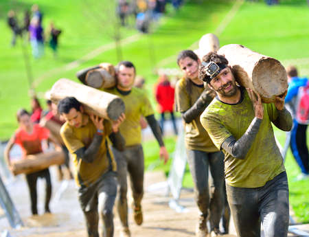 GIJON, SPAIN - JANUARY 31: Farinato Race, extreme obstacle race in January 31, 2016 in Gijon, Spain. People jumping, crawling,passing under a barbed wires or climbing obstacles during extreme obstacle race.のeditorial素材
