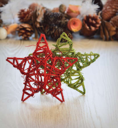 Close-up of green and red handmade Christmas stars on wooden table