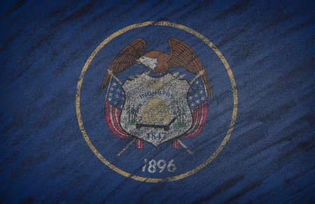 Close-up of national Utah state flag painted with colored chalk on a blackboard.