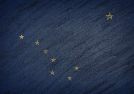 Close-up of national Alaska state flag painted with colored chalk on a blackboard.