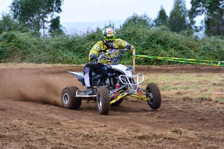 ESCAMPLERO, SPAIN - SEPTEMBER 25: Unidentified racer rides a quad motorbike in the "Promotion Quad Trophy Astur" on September 25, 2016 in Escamplero, Spain.のeditorial素材