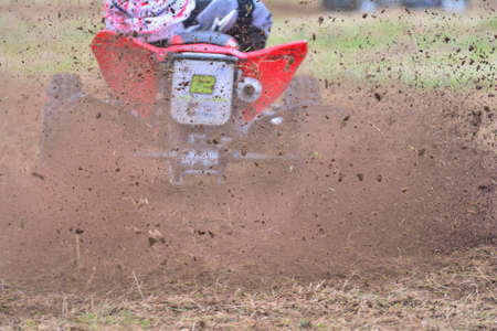 Rear view of a driver on a quad motorbike.のeditorial素材