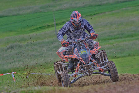 GOZON, SPAIN - MAY 13: Unidentified racer rides a quad motorbike in the "Promotion Quad Trophy Astur" on May 13, 2017 in Gozon, Spain.のeditorial素材