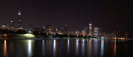 Chicago night skyline across Lake Michigan.の写真素材