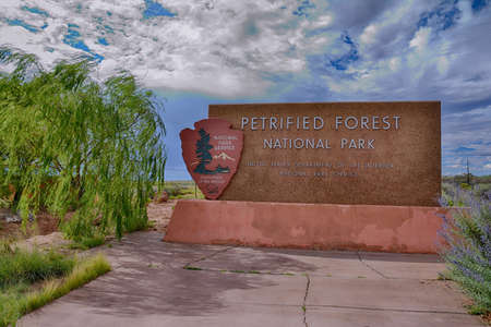 NAVAJO COUNTY, ARIZONA - JULY 22: The entrance sign to the Petrified Forest National Park, a popular tourist destination in Arizona on July 22, 2017 in Petrified Forest, Arizona.のeditorial素材
