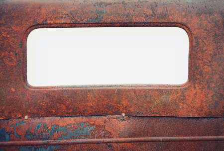 Old rusty car with blank window for copy space.の写真素材