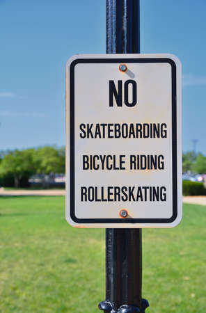 Sign prohibiting bicycles, rollerskating and skateboards.の写真素材