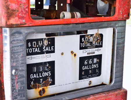Old rusty american gas pump panel, displaying the price in dollars and filling amount in gallonsの写真素材