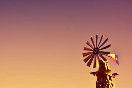 Windmill on an agricultural farm in Texas, USA.の写真素材