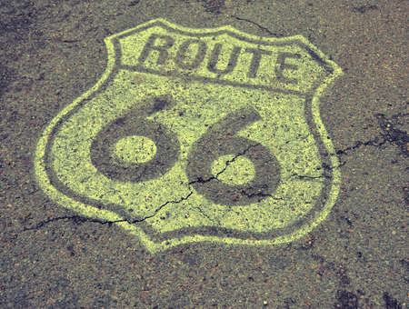 Historic U.S. old Route 66 sign on the asphalt.の写真素材