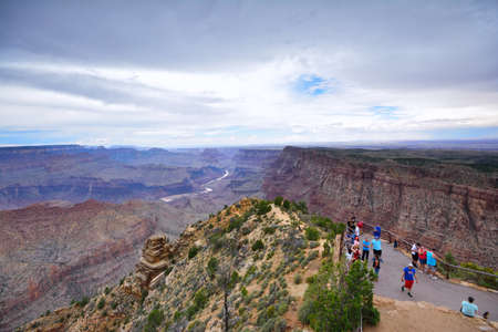 Grand Canyon, Arizona - July 23, 2017: South Rim Grand Canyon, tourists in a viewpoint admiring the views.のeditorial素材