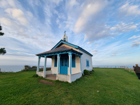 beautiful hermitage located on a cliff overlooking the seaの写真素材