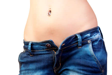 The girl in jeans with a hand in a pocket, and drawing of lips on a stomachの写真素材