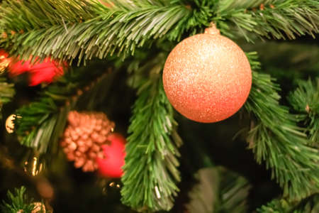 Christmas decorations and lighting on the branches christmas tree, soft focusの写真素材