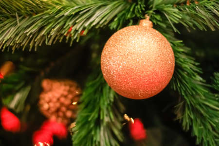 Christmas decorations and lighting on the branches christmas tree, soft focus