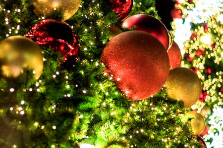 Christmas decorations and lighting on the branches christmas tree, soft focus