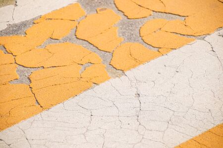 Grunge Road Markings For Pedestrians With Yellow And White Paints texture.の写真素材