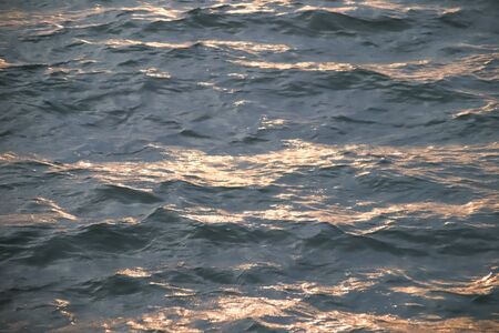 Blue water surface in sunset timeの写真素材