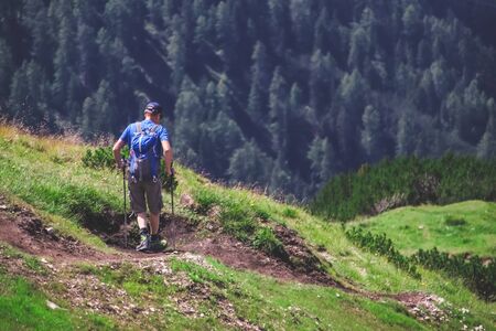 Man hiking in the forest in the summer.の写真素材