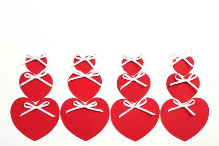 Valentine's day cut red paper heart with white background.の写真素材