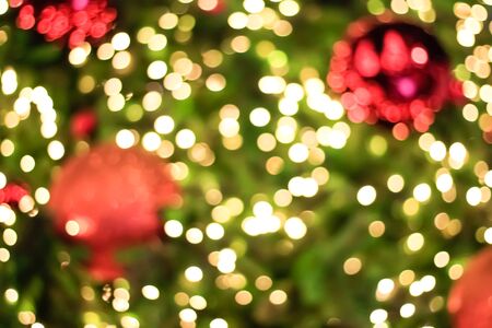 Lighting blurred bokeh on Christmas tree backgroundの写真素材
