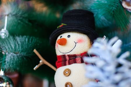 Decoration Snowman on christmas tree backgroundの写真素材
