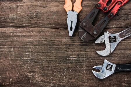 Pliers old craftsman tool on wooden table, vintage  style