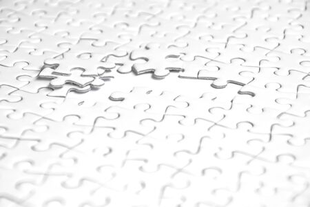 Selective focus of pieces white jigsaw puzzle, Business solution concept, collaborate conceptの写真素材