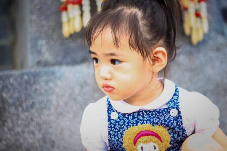 Outdoor Portrait of Little asian girlの写真素材
