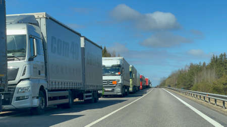 2022 04 12 Lithuania, road to the Lithuanian-Belarus border crossing   in Medininkai. Cargo truck queue - more than 12 km in length. Similar queues are in other main border crossings. Video availableのeditorial素材