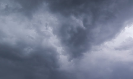Dark stormy sky with black clouds. Dramatic monochrome sky background