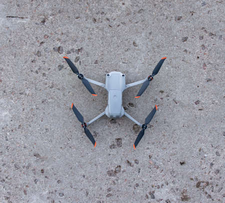 Small drone with good camera landed on the hard surface for demonstration reference photo