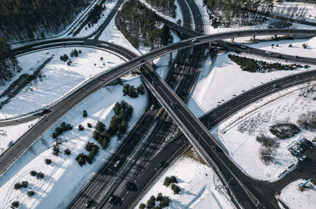 Aerial view of highway in winter with snow covered road and cars.の写真素材