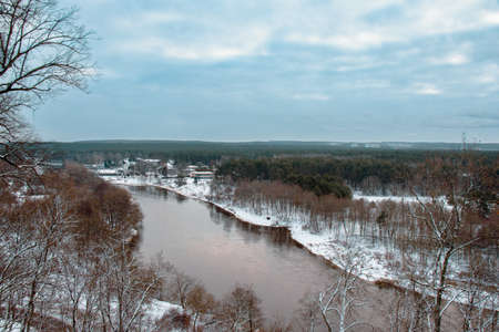 Aerial view of the river and the forest. Winter landscape.の写真素材