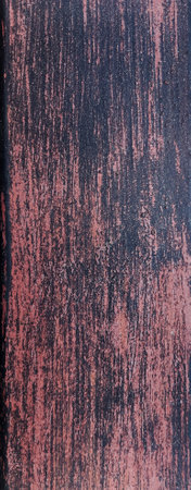 Scratched red paint from metallic surface texture. Abstract background for design with copy space...