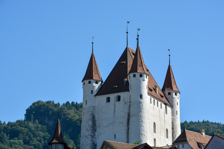 Castle of the swiss town Thun at the lake "Thunersee" in the sunの写真素材