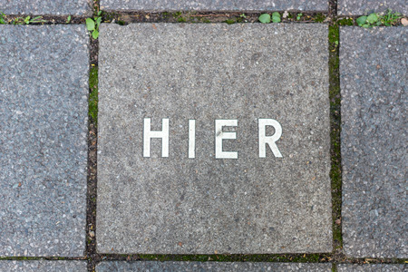 The German word for Here written on a stone on a walkway in Nuremberg from above