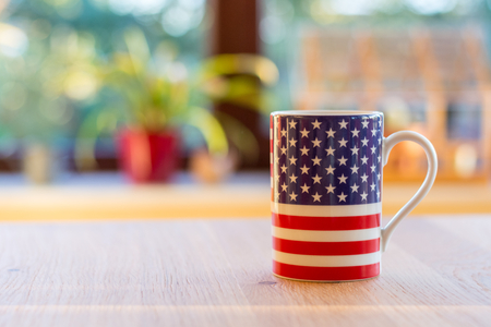 A flag of the United States of America on a mug close up and blurry backgroundの写真素材