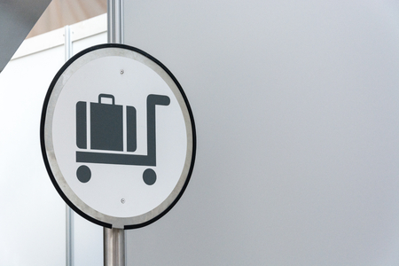 White luggage claim sign with blank space close upの写真素材