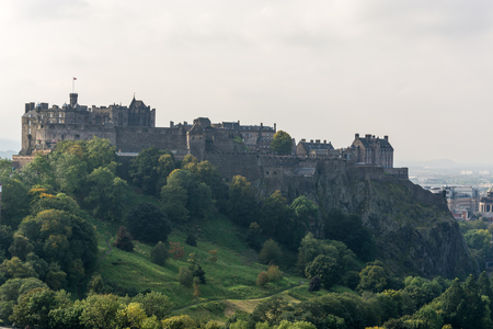 Edinburgh castle behind a tree as seen from Scott Monumentのeditorial素材