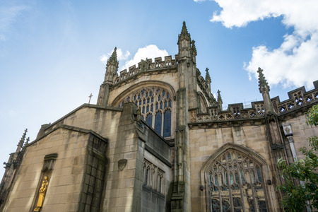 The cathedral of Manchester from the side with blue skyの写真素材